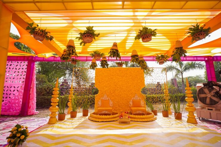 haldi-decoration-wedding-hall-decorations-sofa-flowers_143921-1147